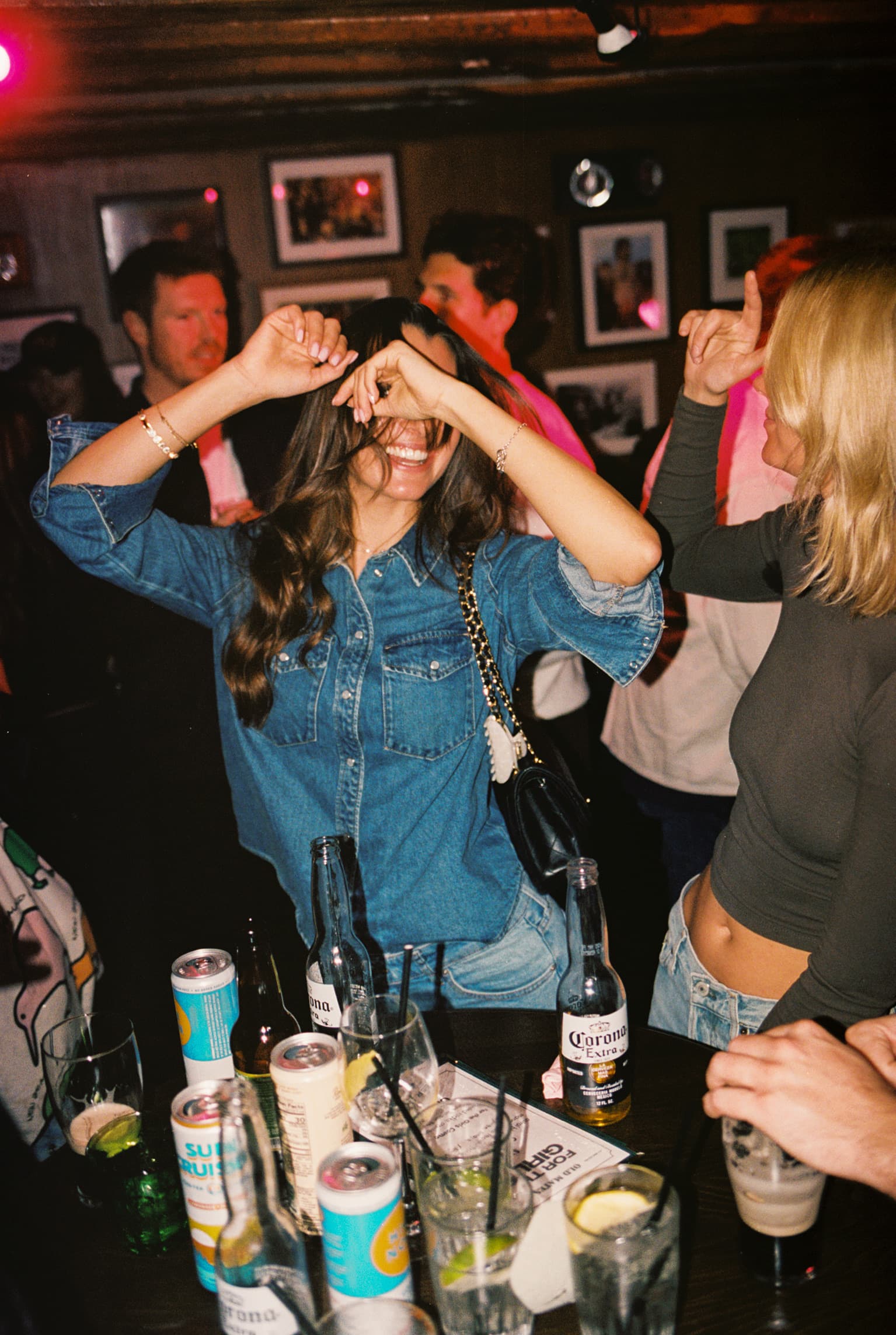 Guests gathered together in an intimate nightlife setting.