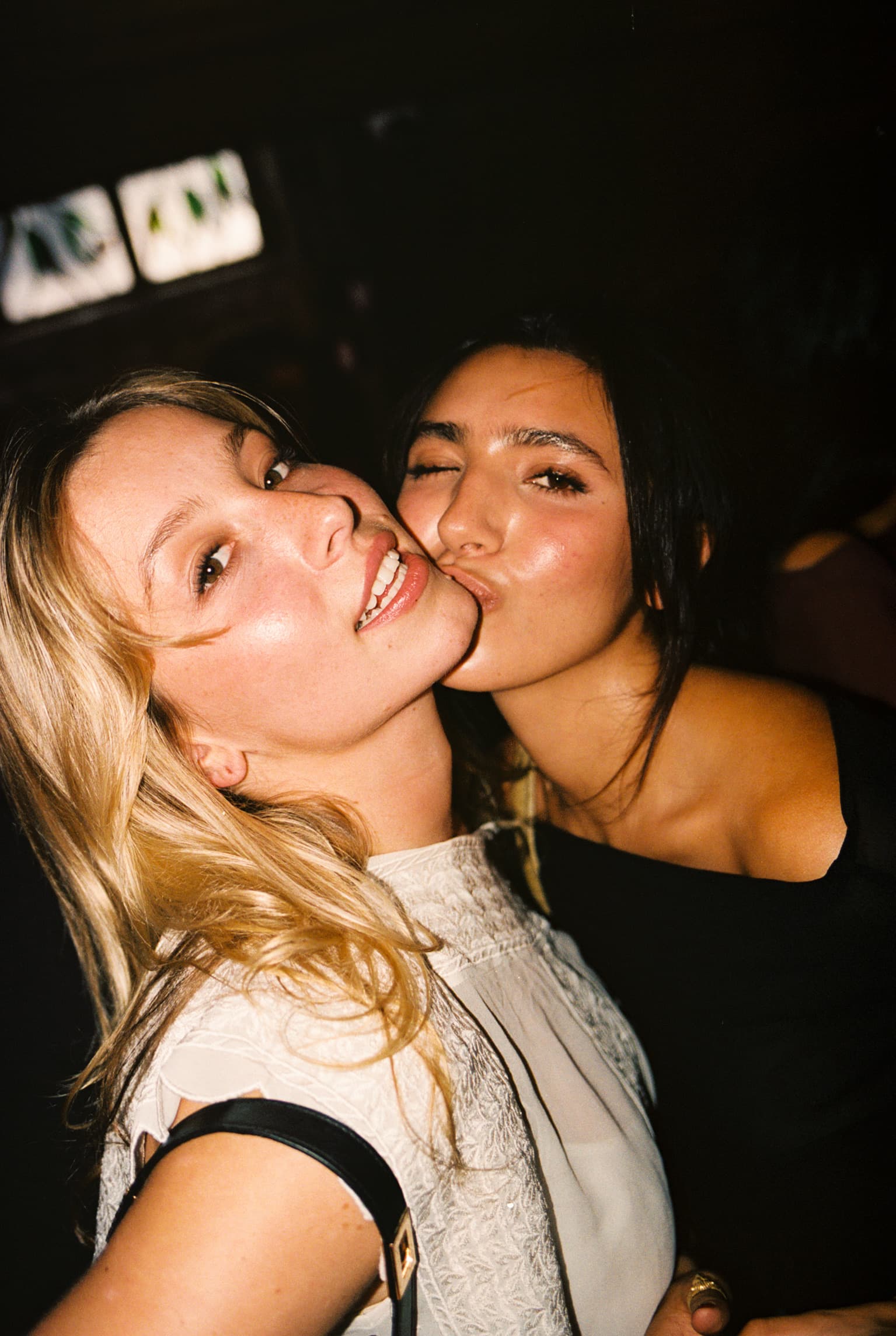 Two friends smiling together at a Cerca event.